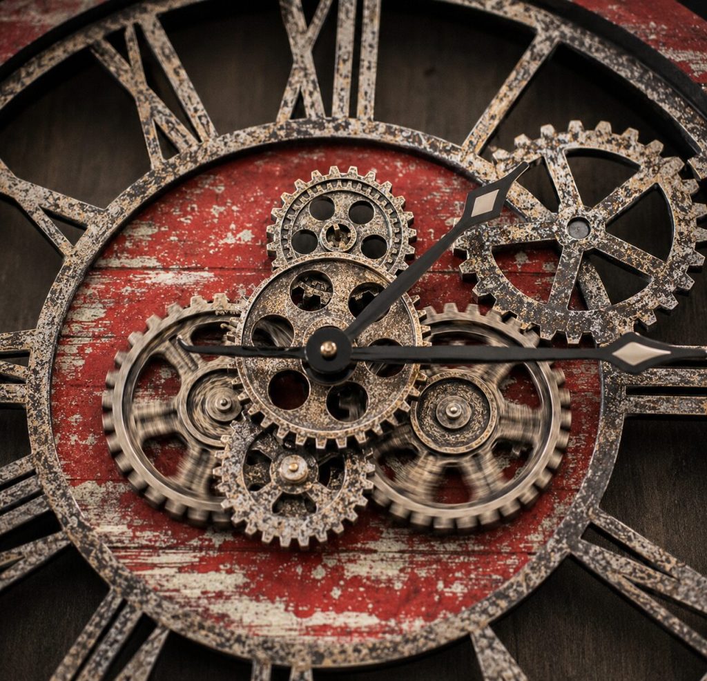 Close-up of ImprovingLife gears in motion, showing actual gear teeth and Red Lava texture